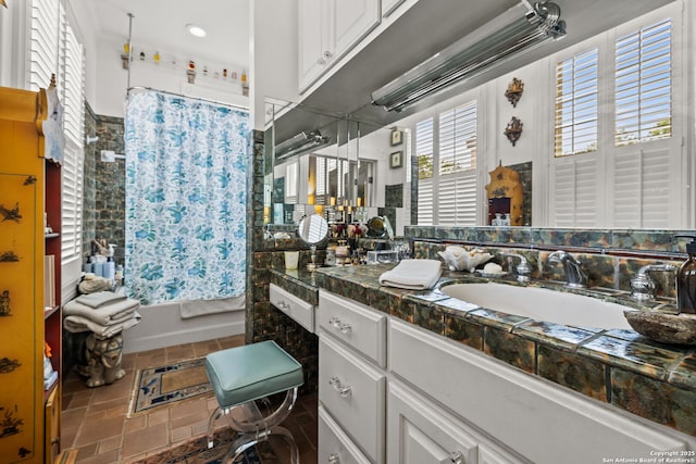 112 King William, San Antonio, TX 78204 - bathroom with shower / bathtub combination with curtain, stone finish flooring, and vanity