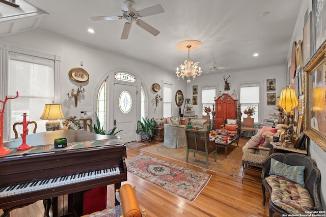 112 King William, San Antonio, TX 78204 - living area featuring a healthy amount of sunlight, ceiling fan with notable chandelier, light wood-style floors, and crown molding