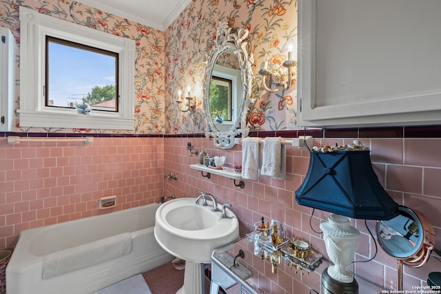 112 King William, San Antonio, TX 78204 - bathroom with tile walls, a bath, crown molding, a wainscoted wall, and wallpapered walls