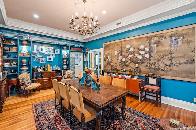 112 King William, San Antonio, TX 78204 - dining room with recessed lighting, wood finished floors, a notable chandelier, and crown molding