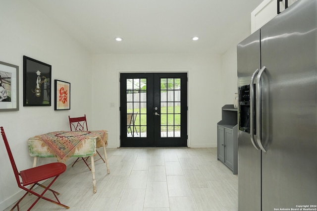 doorway to outside featuring baseboards, recessed lighting, and french doors