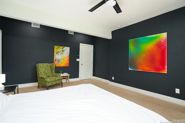 bedroom with baseboards, visible vents, and ceiling fan