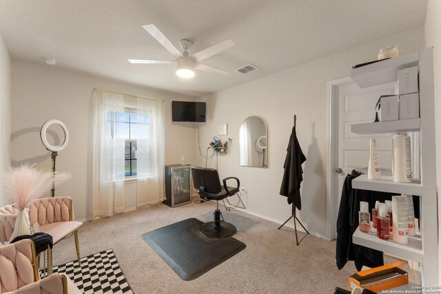 workout area featuring carpet flooring, visible vents, ceiling fan, and baseboards