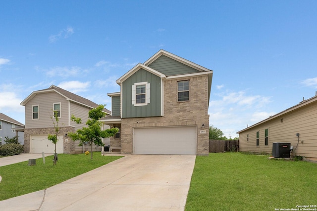 craftsman inspired home featuring board and batten siding, a front yard, and a garage