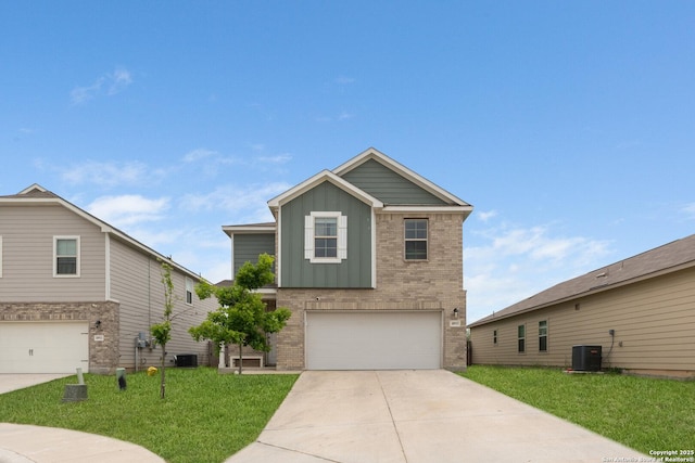 view of front of property with a front yard, a garage, central AC, board and batten siding, and brick siding