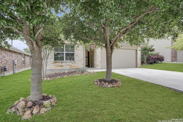 view of property hidden behind natural elements with a front yard, driveway, stone siding, and a garage
