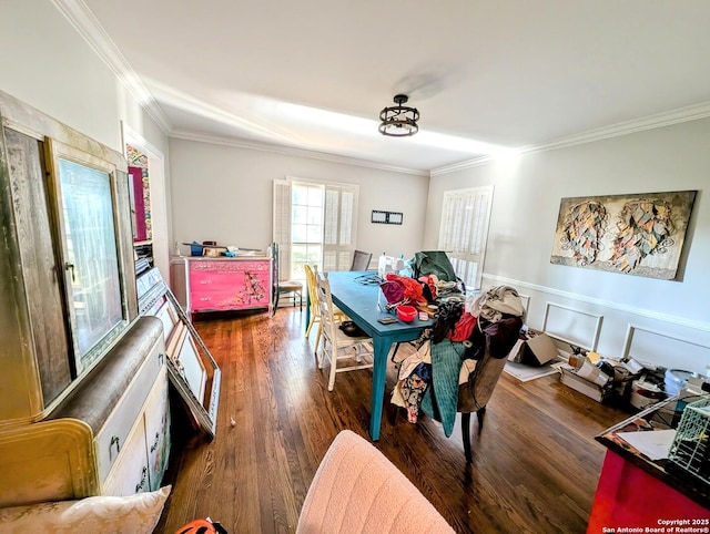 2465 Gladys St, Beaumont, TX 77702 - dining area with ornamental molding, a wainscoted wall, and wood finished floors