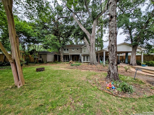 2465 Gladys St, Beaumont, TX 77702 - view of yard with a fire pit and fence
