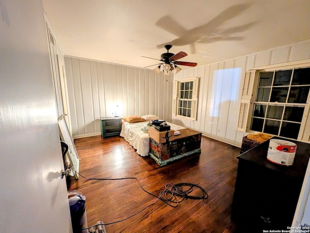 2465 Gladys St, Beaumont, TX 77702 - bedroom with wood finished floors and ceiling fan