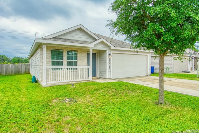 ranch-style house with fence, a front yard, driveway, and an attached garage