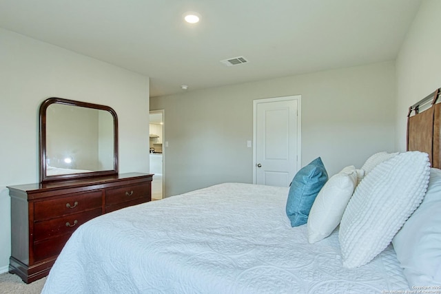 carpeted bedroom featuring baseboards, visible vents, and recessed lighting