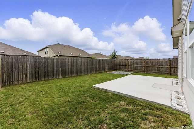 view of yard featuring a patio and a fenced backyard