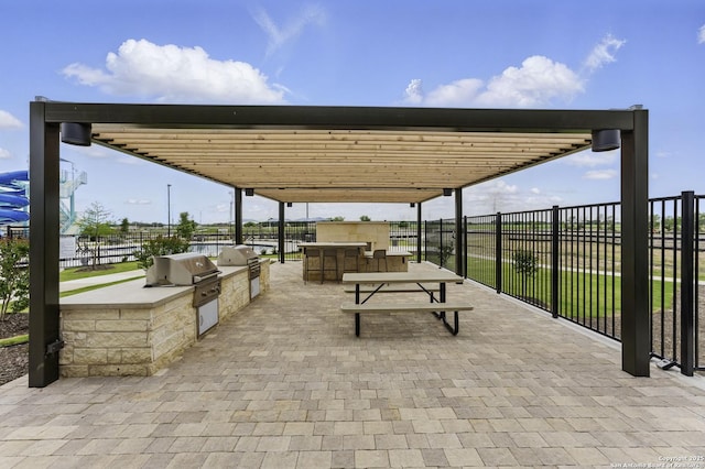 view of patio / terrace featuring fence and area for grilling