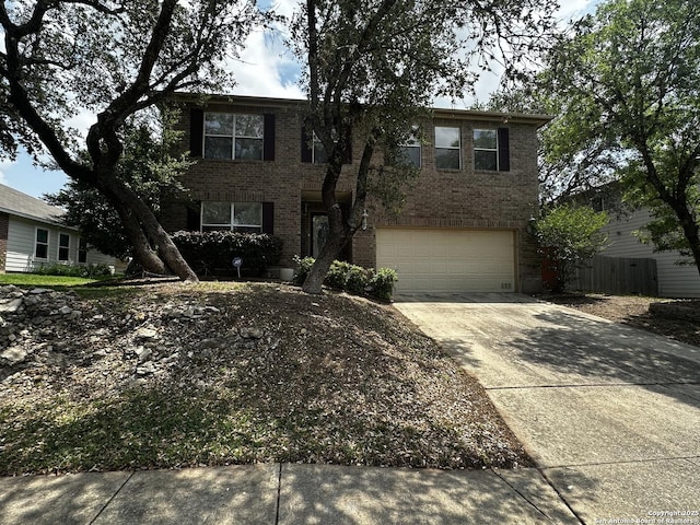 9528 Braun, San Antonio, TX 78254 - traditional-style house featuring concrete driveway, brick siding, and a garage