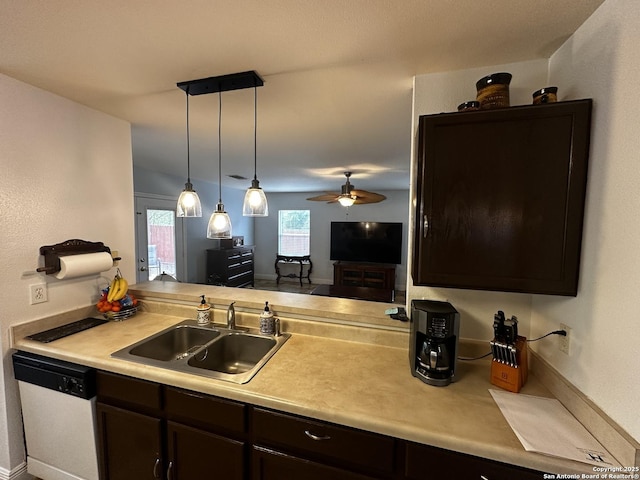 9528 Braun, San Antonio, TX 78254 - kitchen featuring dark brown cabinetry, light countertops, white dishwasher, a sink, and a ceiling fan
