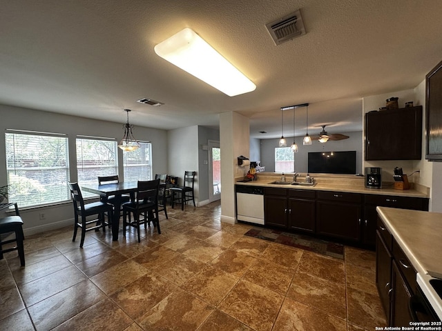 9528 Braun, San Antonio, TX 78254 - kitchen featuring baseboards, visible vents, a sink, and white dishwasher