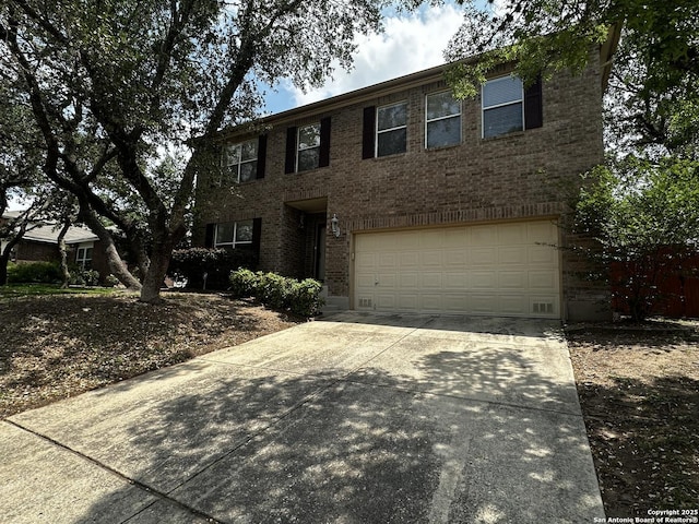 9528 Braun, San Antonio, TX 78254 - colonial inspired home featuring concrete driveway, brick siding, and an attached garage