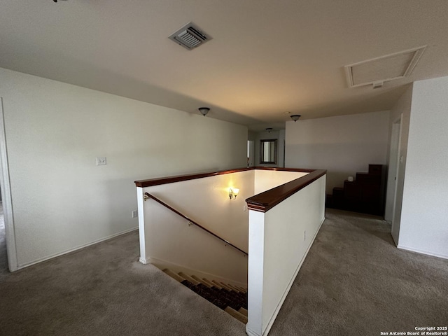 9528 Braun, San Antonio, TX 78254 - hallway featuring an upstairs landing, visible vents, baseboards, and carpet floors