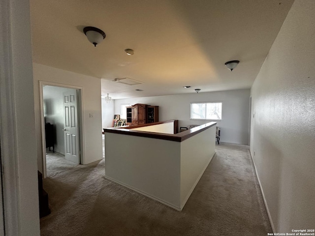 9528 Braun, San Antonio, TX 78254 - kitchen featuring a center island, baseboards, and light carpet