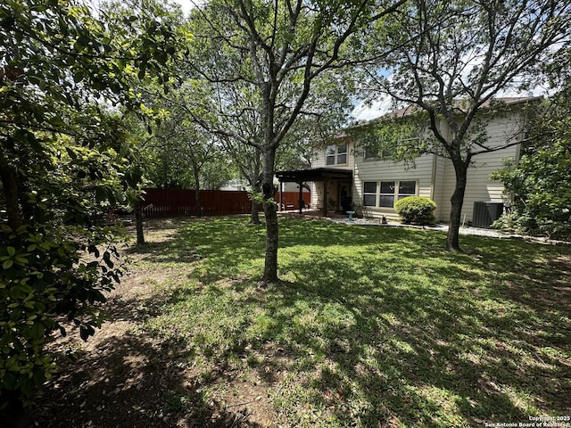 9528 Braun, San Antonio, TX 78254 - view of yard featuring central air condition unit and fence