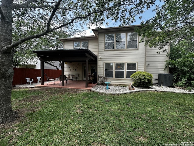 9528 Braun, San Antonio, TX 78254 - rear view of house featuring cooling unit, a patio, a lawn, and fence