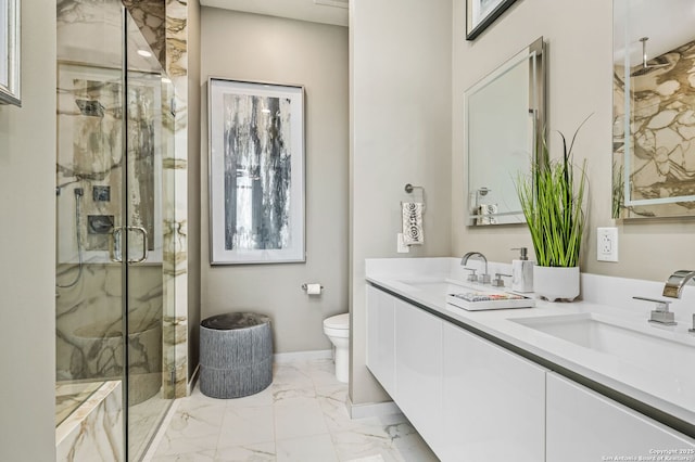 bathroom featuring a marble finish shower, marble finish floor, toilet, and a sink
