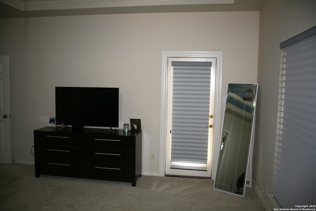 carpeted bedroom featuring baseboards