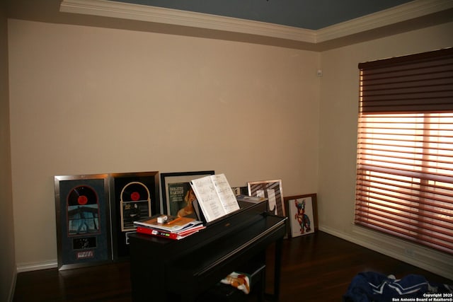 sitting room with dark wood finished floors, baseboards, and ornamental molding