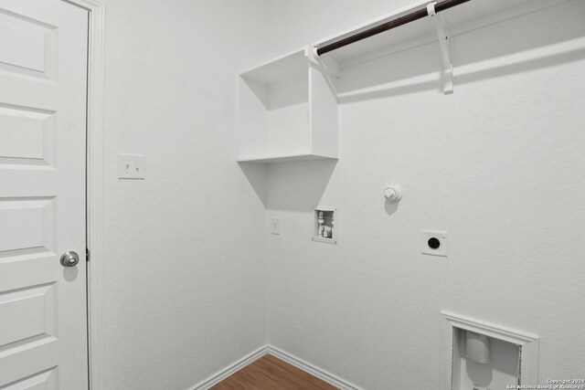 laundry area with hookup for a gas dryer, laundry area, electric dryer hookup, hookup for a washing machine, and baseboards
