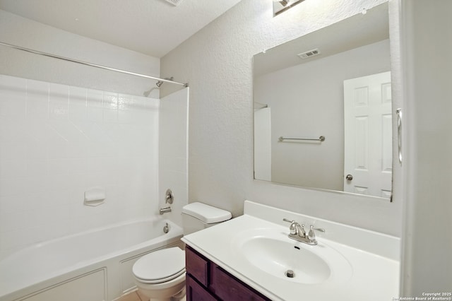 bathroom featuring a textured wall, visible vents, toilet, shower / bathing tub combination, and vanity