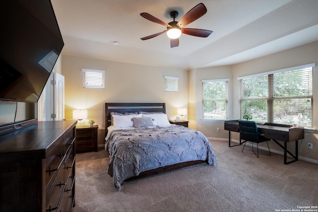carpeted bedroom featuring ceiling fan and baseboards