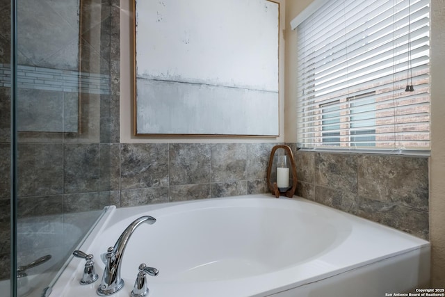 bathroom featuring a garden tub