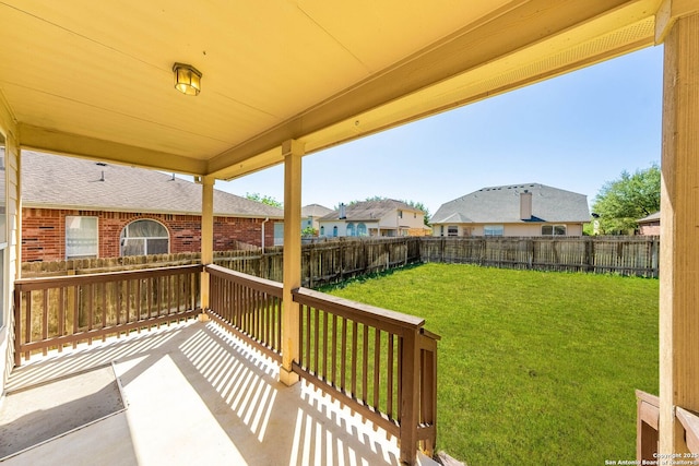 exterior space with a yard, a residential view, and a fenced backyard
