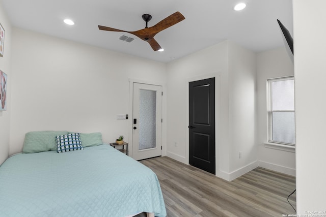 bedroom featuring recessed lighting, light wood-type flooring, baseboards, visible vents, and a ceiling fan