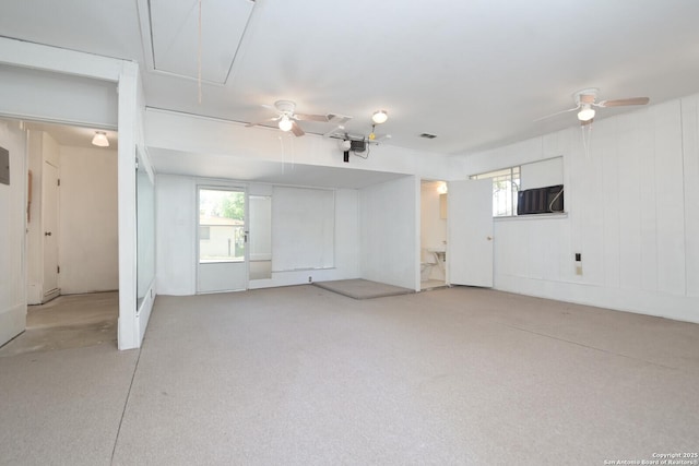 interior space featuring attic access and ceiling fan