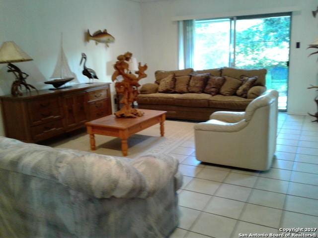 living area with light tile patterned floors