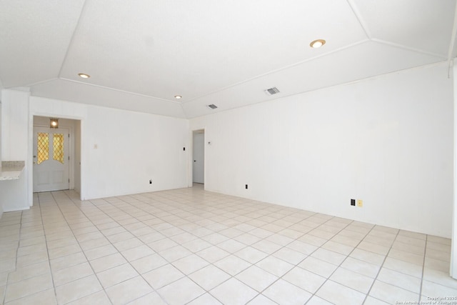 empty room with recessed lighting, visible vents, and lofted ceiling