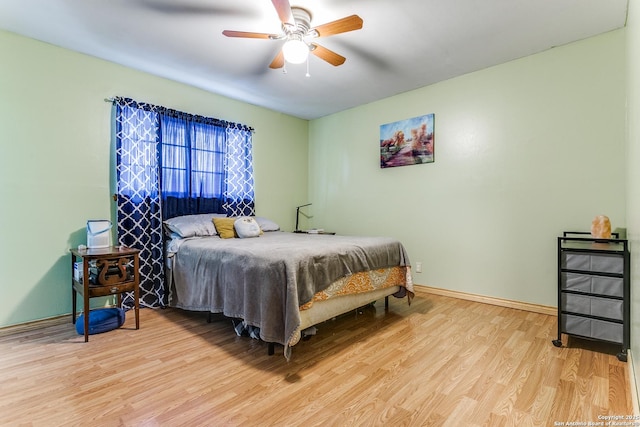 6835 Spring Hurst, San Antonio, TX 78249 - bedroom featuring a ceiling fan, light wood-style flooring, and baseboards