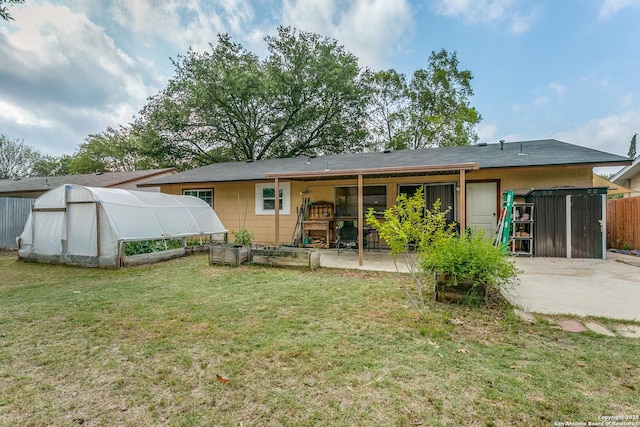 6835 Spring Hurst, San Antonio, TX 78249 - rear view of house with a patio area, an outbuilding, fence, a yard, and an exterior structure