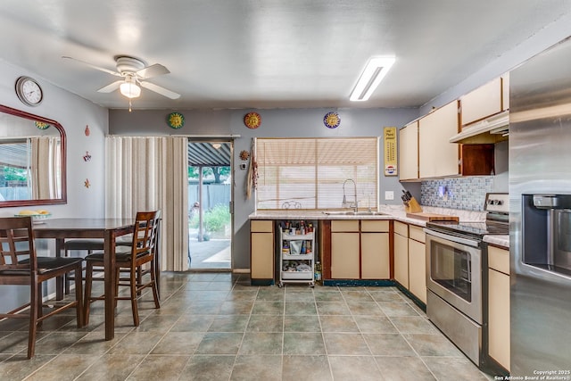 6835 Spring Hurst, San Antonio, TX 78249 - kitchen with a sink, appliances with stainless steel finishes, light countertops, under cabinet range hood, and a ceiling fan