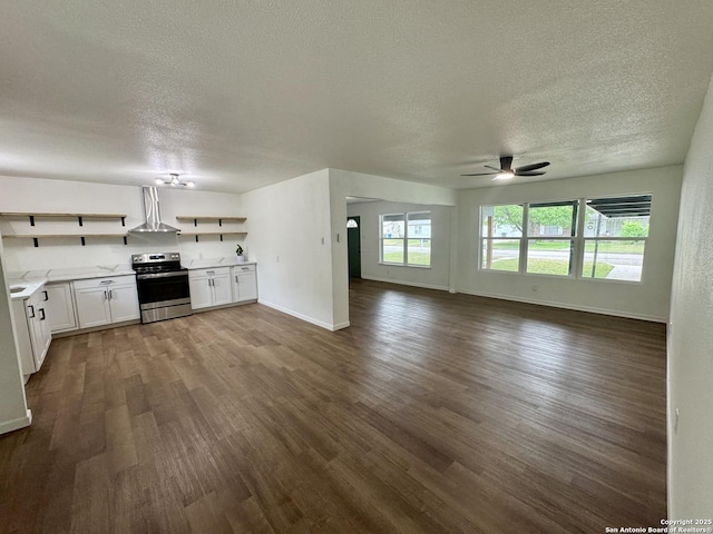 629 Melrose, Seguin, TX 78155 - interior space featuring a textured ceiling, stainless steel range with electric cooktop, dark wood-type flooring, and open shelves