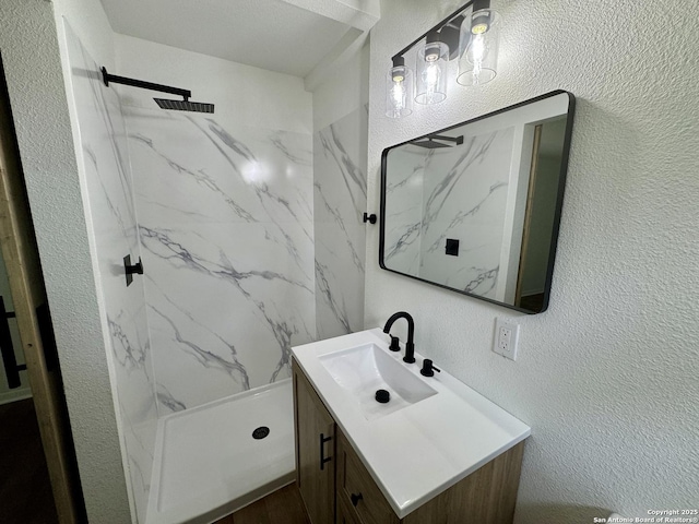 629 Melrose, Seguin, TX 78155 - full bathroom with a marble finish shower, a textured wall, and vanity