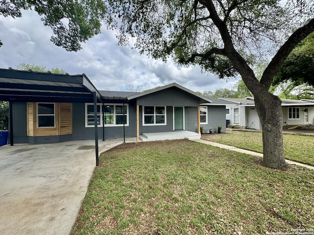 629 Melrose, Seguin, TX 78155 - single story home featuring a front lawn, an attached carport, and concrete driveway