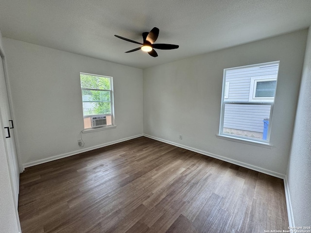 629 Melrose, Seguin, TX 78155 - empty room featuring dark wood finished floors, baseboards, and ceiling fan