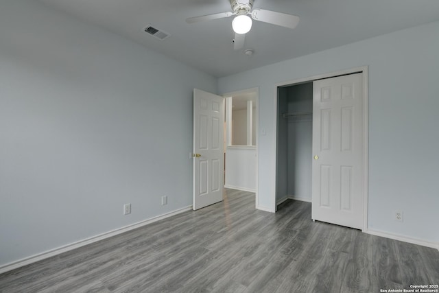 6015 Wexford Pl, San Antonio, TX 78240 - unfurnished bedroom featuring visible vents, a closet, baseboards, wood finished floors, and a ceiling fan