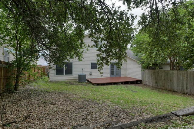 6015 Wexford Pl, San Antonio, TX 78240 - back of property featuring a deck, a fenced backyard, central AC unit, and a yard