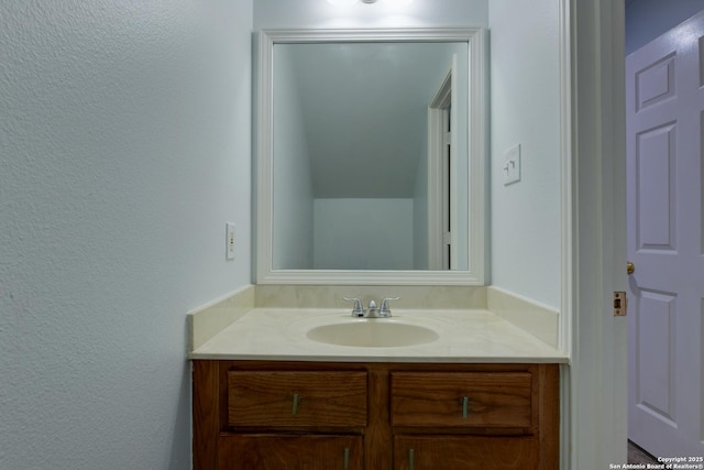 6015 Wexford Pl, San Antonio, TX 78240 - bathroom featuring a textured wall and vanity