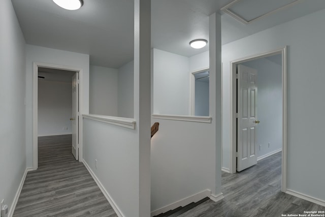 6015 Wexford Pl, San Antonio, TX 78240 - corridor featuring an upstairs landing, attic access, wood finished floors, and baseboards