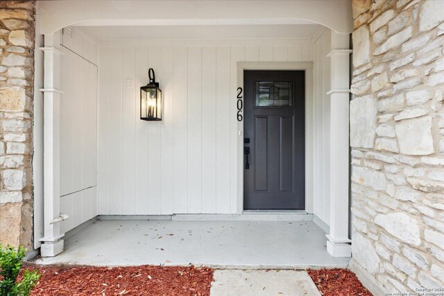 view of exterior entry with stone siding