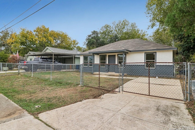 view of front of house featuring stucco siding, a gate, a front yard, and a fenced front yard